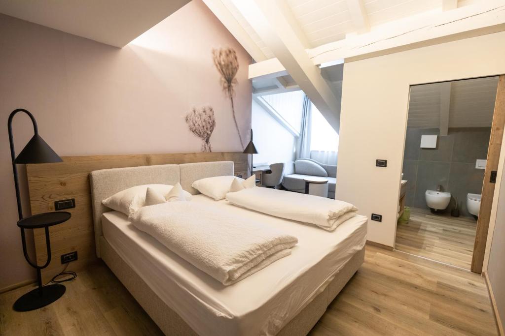 Postel nebo postele na pokoji v ubytování Hotel Alpenrose Wellness