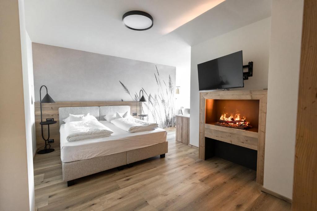 Postel nebo postele na pokoji v ubytování Hotel Alpenrose Wellness