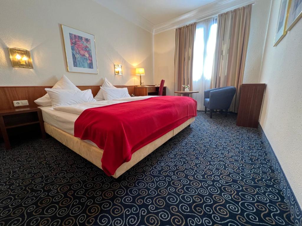 Postel nebo postele na pokoji v ubytování Stadthotel