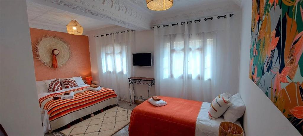 Postel nebo postele na pokoji v ubytování CASA ZOUINA