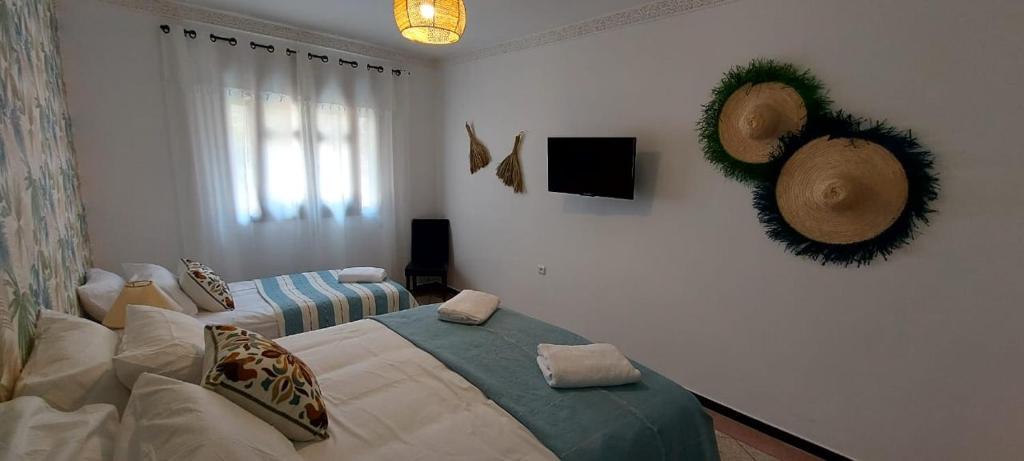 Postel nebo postele na pokoji v ubytování CASA ZOUINA