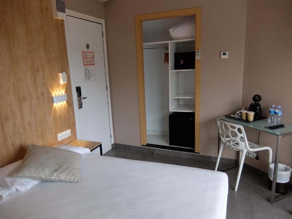 Postel nebo postele na pokoji v ubytování Hotel Medicis