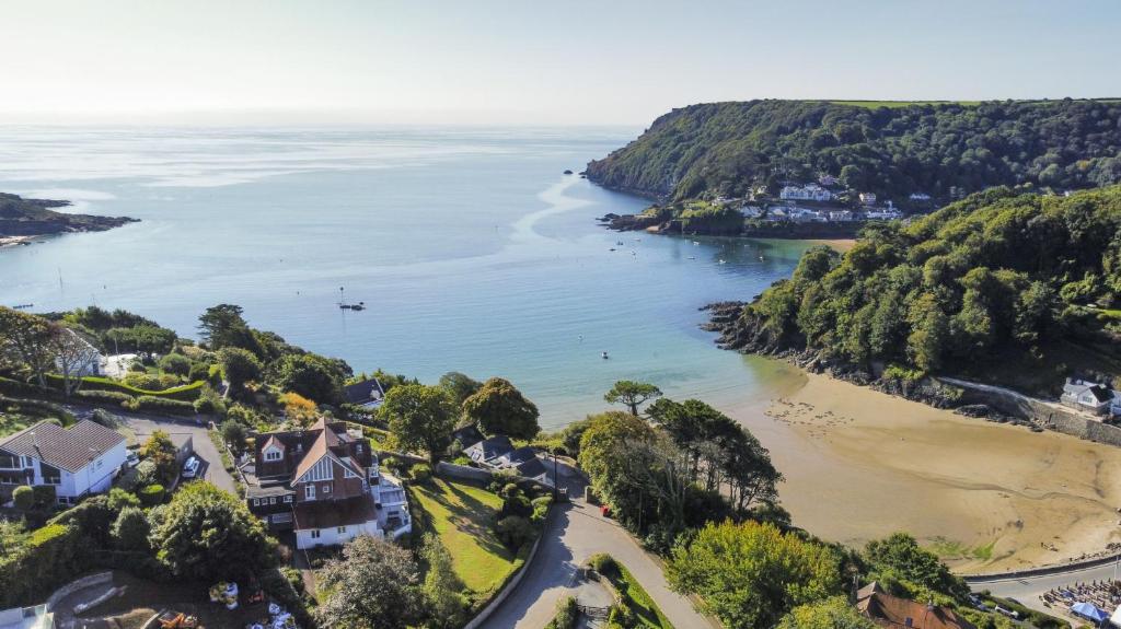 an aerial view of a beach with houses and trees at 2 St Elmo Lodge in Salcombe