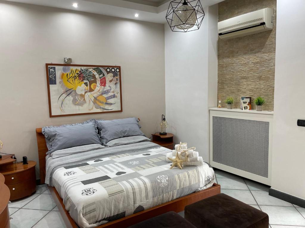 a bedroom with a large bed and a radiator at Sky and Green Luxury Apartament in Boscoreale