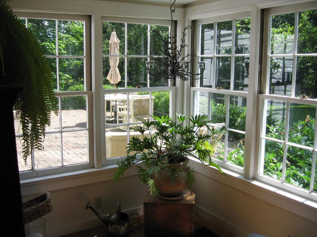 a window with a potted plant in a room at Private setting on country farm near Rhinebeck in Clinton Corners