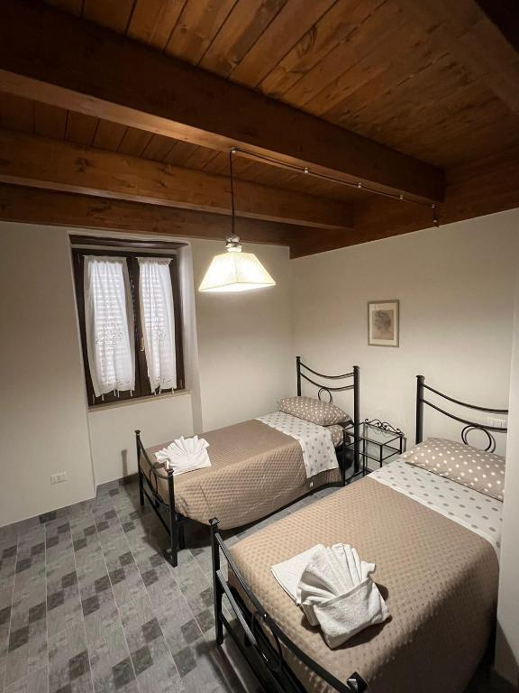 Postel nebo postele na pokoji v ubytování Ferruccio's House