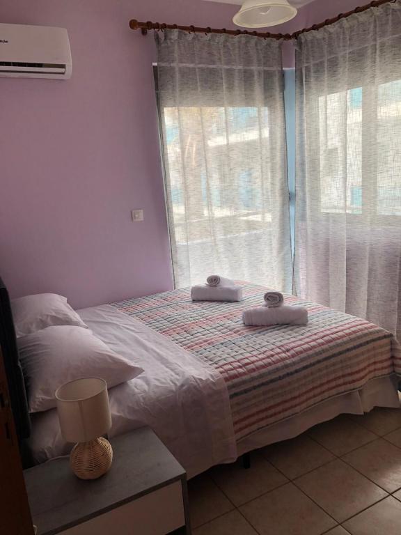 Postel nebo postele na pokoji v ubytování Primordial Apartment