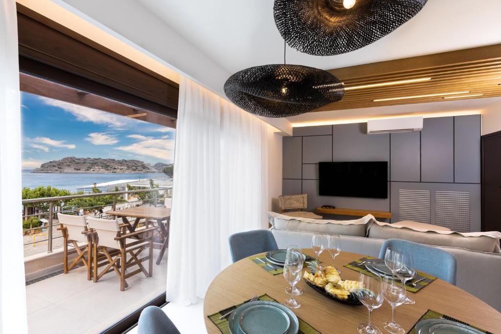 a dining room with a view of the ocean at La Vista Azul - Sea View Apartment in Pláka