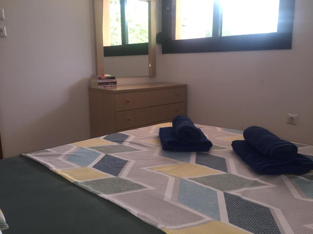 Postel nebo postele na pokoji v ubytování Little Ema