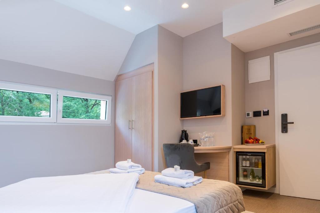 Postel nebo postele na pokoji v ubytování Emilia Lux Rooms