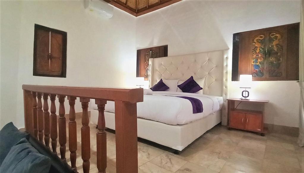Postel nebo postele na pokoji v ubytování Matahari Inn Kuta Lombok