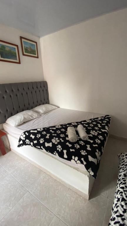 Postel nebo postele na pokoji v ubytování Hostal El Danubio Tolu