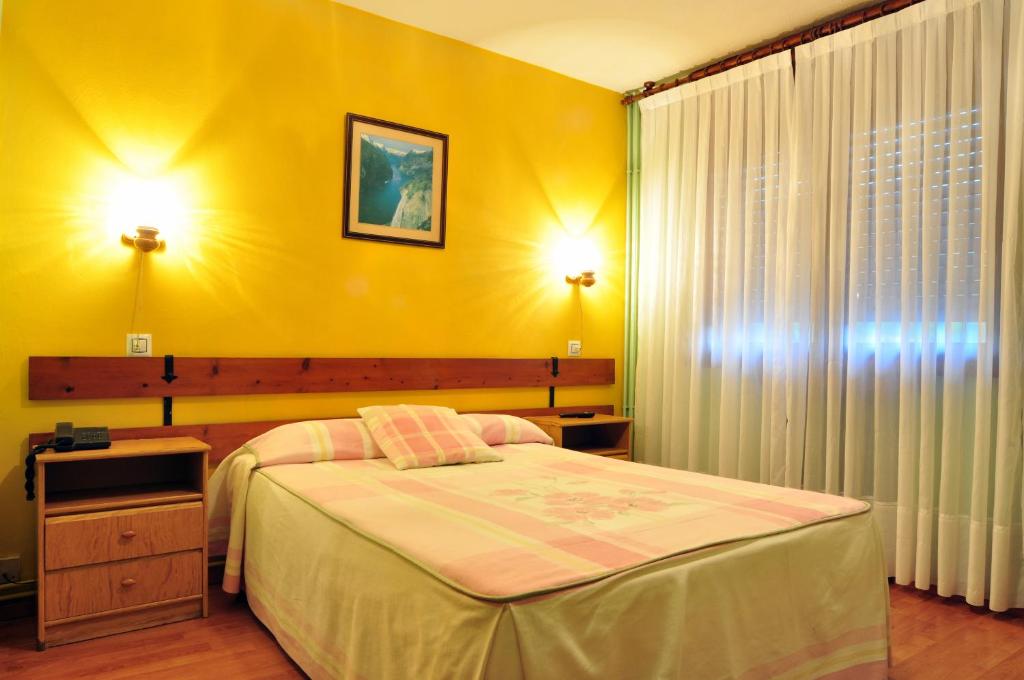 Postel nebo postele na pokoji v ubytování Hostal Europa