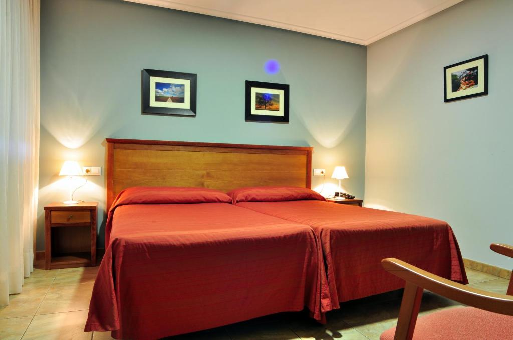 Postel nebo postele na pokoji v ubytování Hostal Europa
