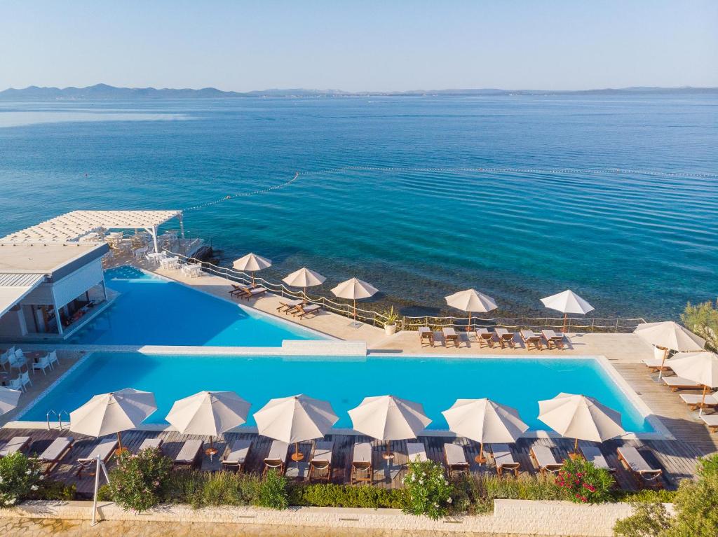 an aerial view of a resort with a swimming pool at Sunnyside Apartments Resort Petrcane in Petrcane