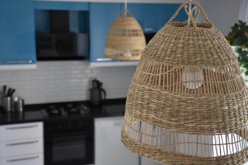 a wicker basket hanging in a kitchen at Serenity Apart in Antalya