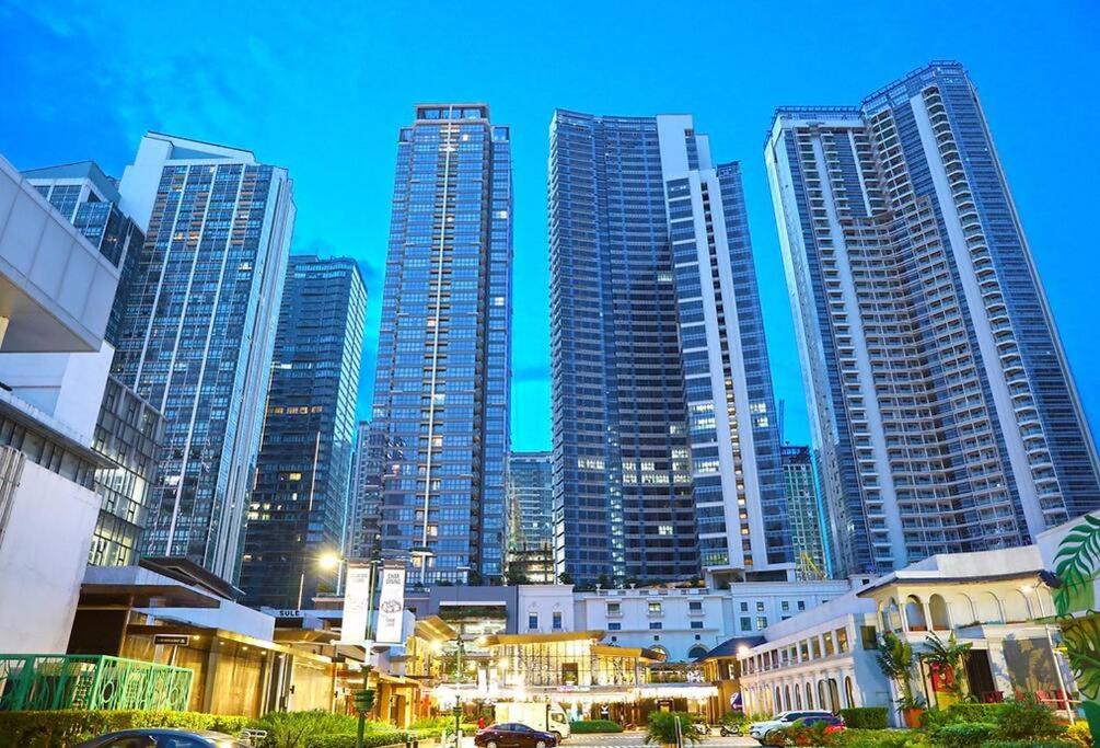 a group of tall buildings in a city at BGC Uptown 1 BR Condo in Manila