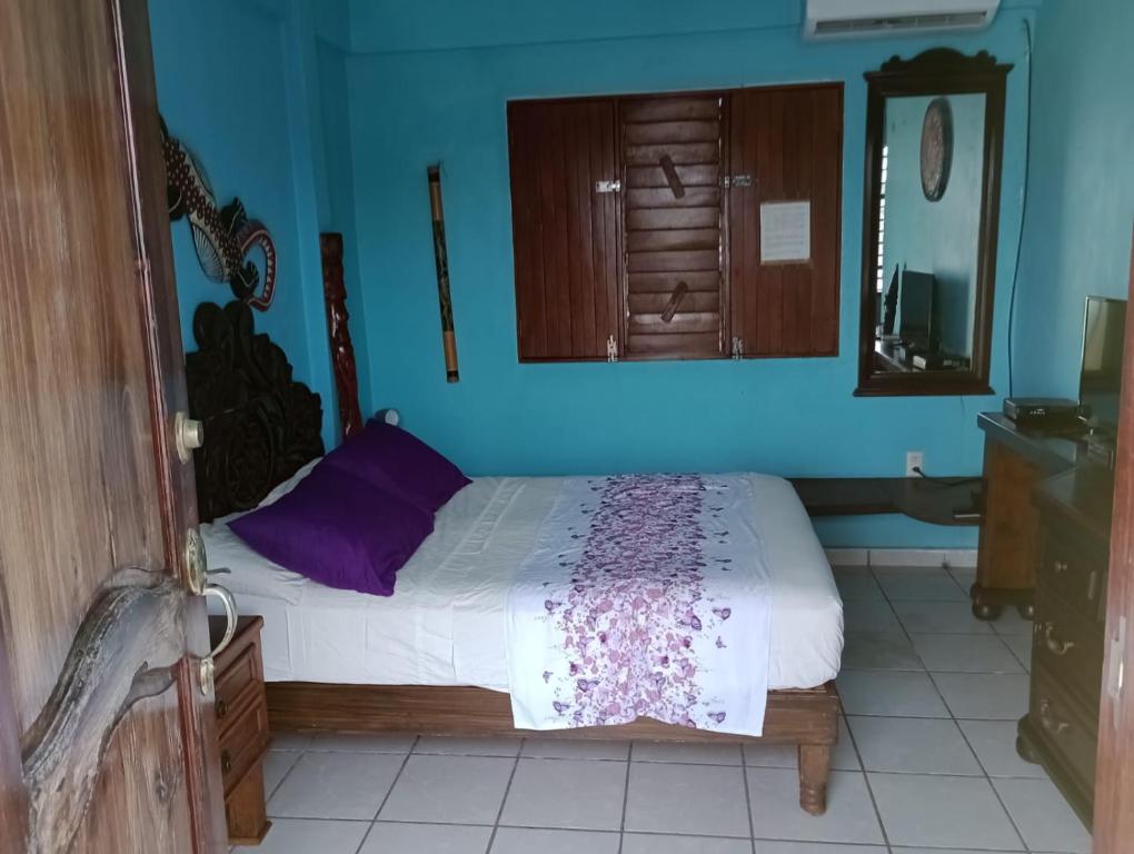 Postel nebo postele na pokoji v ubytování AH KIN Cancun Centro