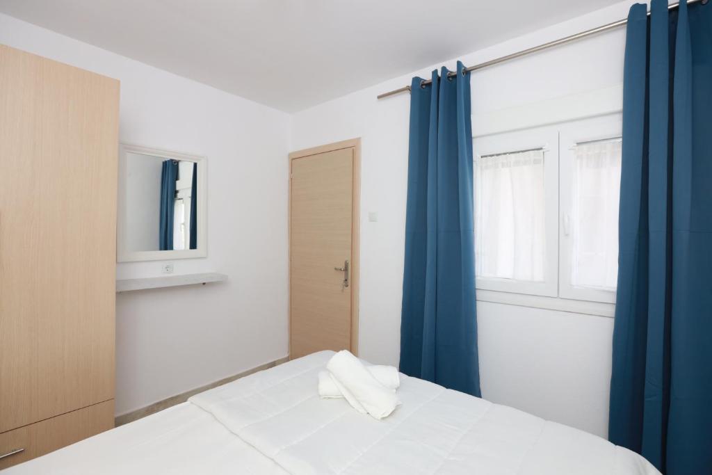 Postel nebo postele na pokoji v ubytování Vergia Apartment 1