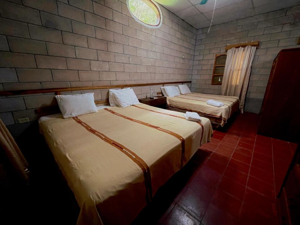 Postel nebo postele na pokoji v ubytování El Bosque Hotel