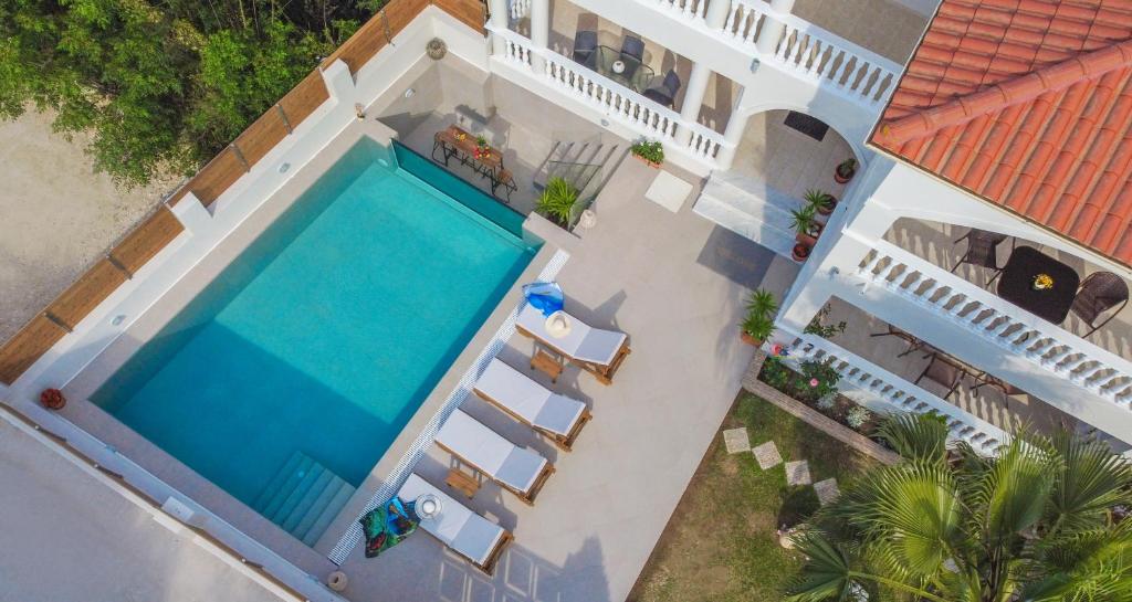 an aerial view of a house with a swimming pool at Estella Luxury Villa in Amoudi -200m from the beach in Amoudi