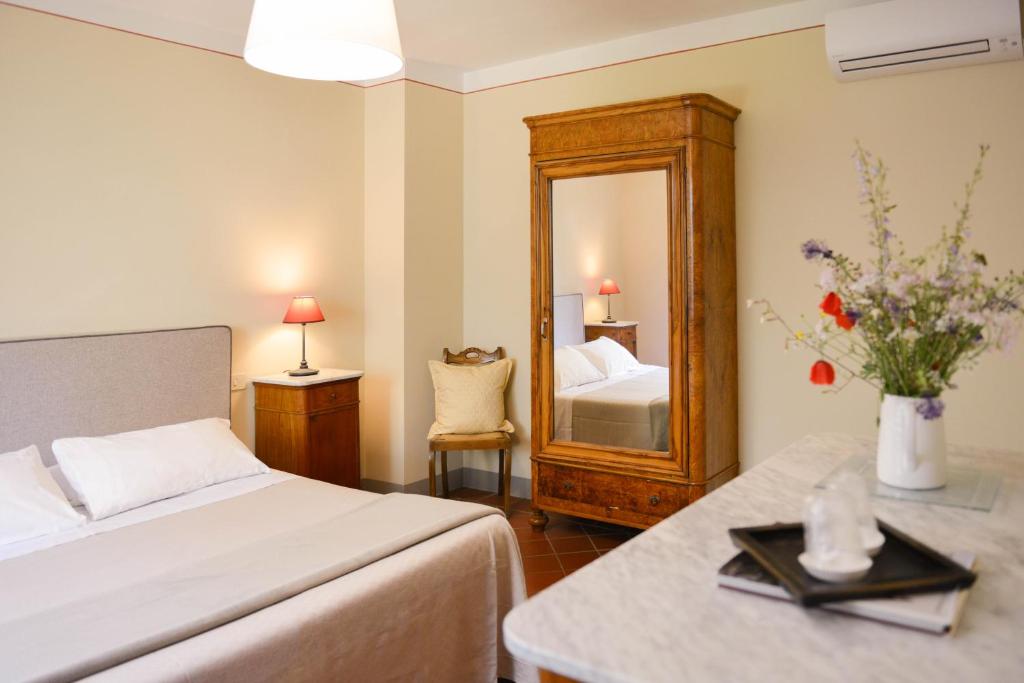 Postel nebo postele na pokoji v ubytování Relais Farinati - Adults Only