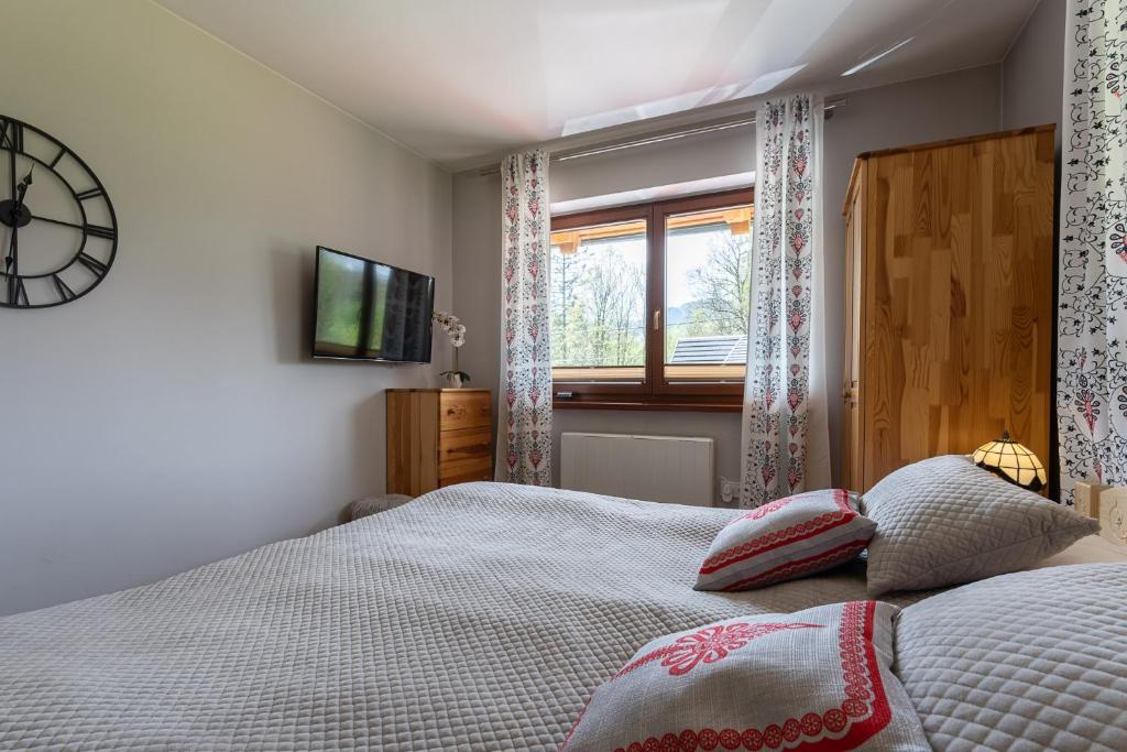 Posteľ alebo postele v izbe v ubytovaní Apartament Sobiczkowa Zakopane