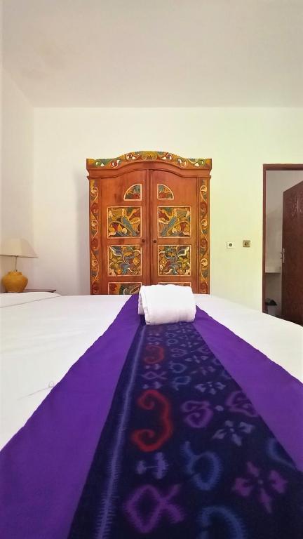 Postel nebo postele na pokoji v ubytování Matahari Inn Kuta Lombok