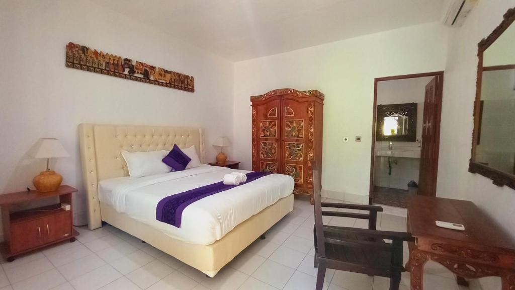 Postel nebo postele na pokoji v ubytování Matahari Inn Kuta Lombok