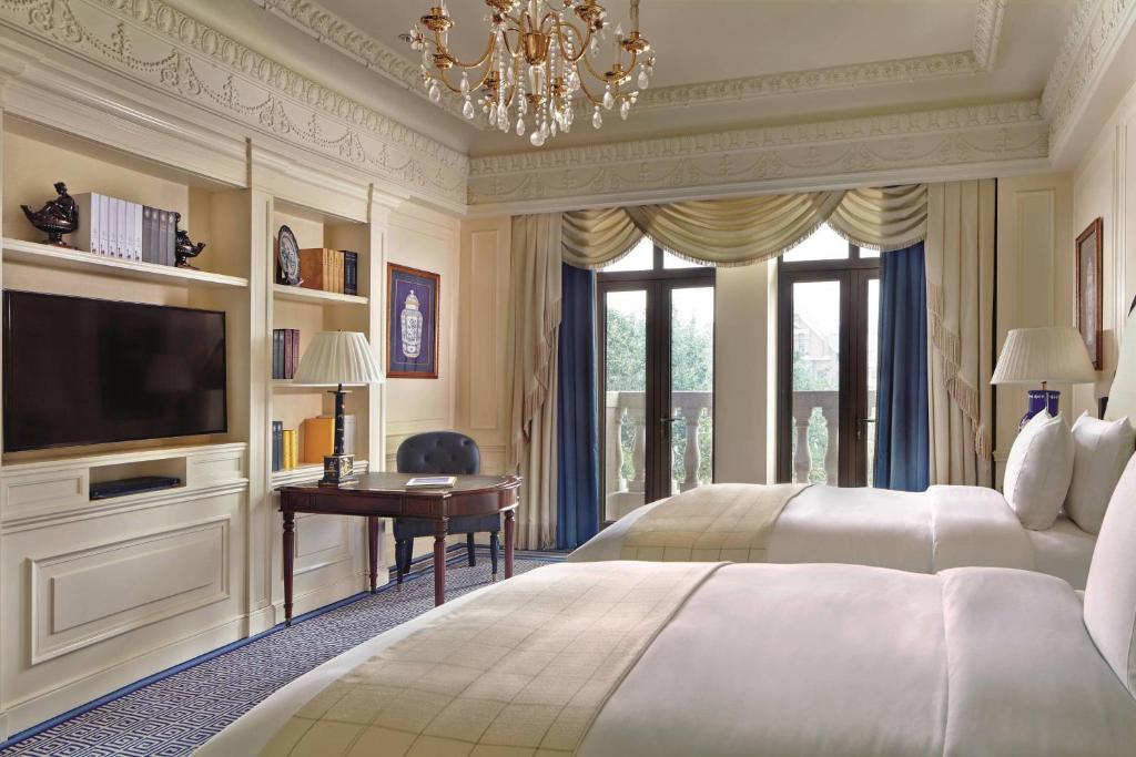 Postel nebo postele na pokoji v ubytování The Ritz-Carlton, Tianjin