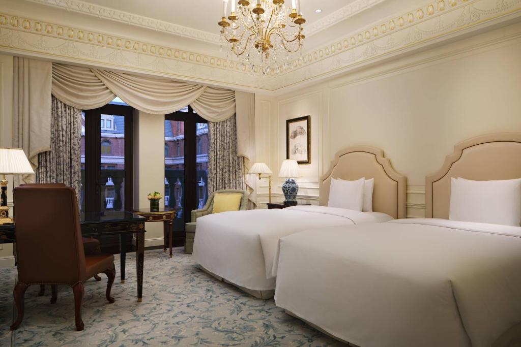 Postel nebo postele na pokoji v ubytování The Ritz-Carlton, Tianjin