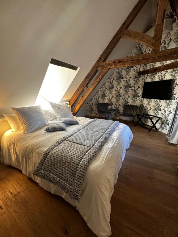 Postel nebo postele na pokoji v ubytování Les Deux Marguerite