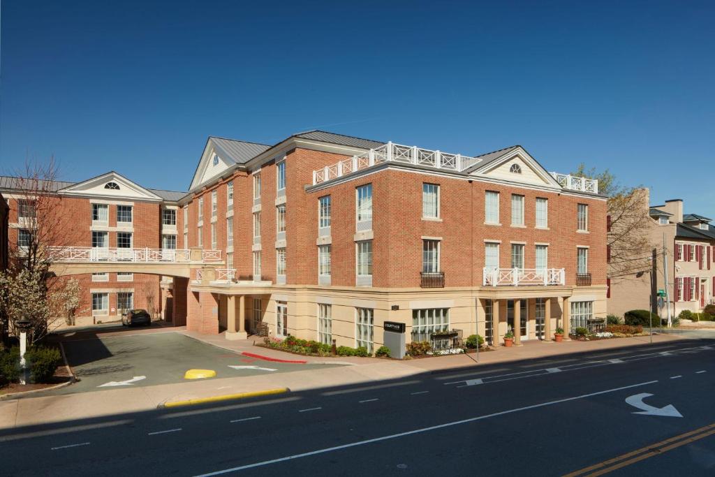 a large brick building on the side of a street at Courtyard by Marriott Charlottesville - University Medical Center in Charlottesville