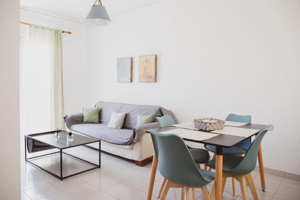 a living room with a couch and a table at Mimis Villa in Igoumenitsa