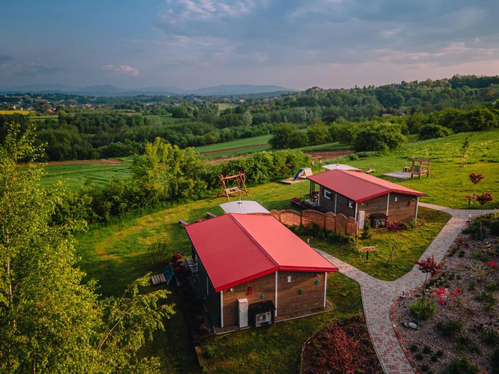 an aerial view of a cabin with a red roof at Domki na Górniej Łące - Dwa Wróble in Łazany