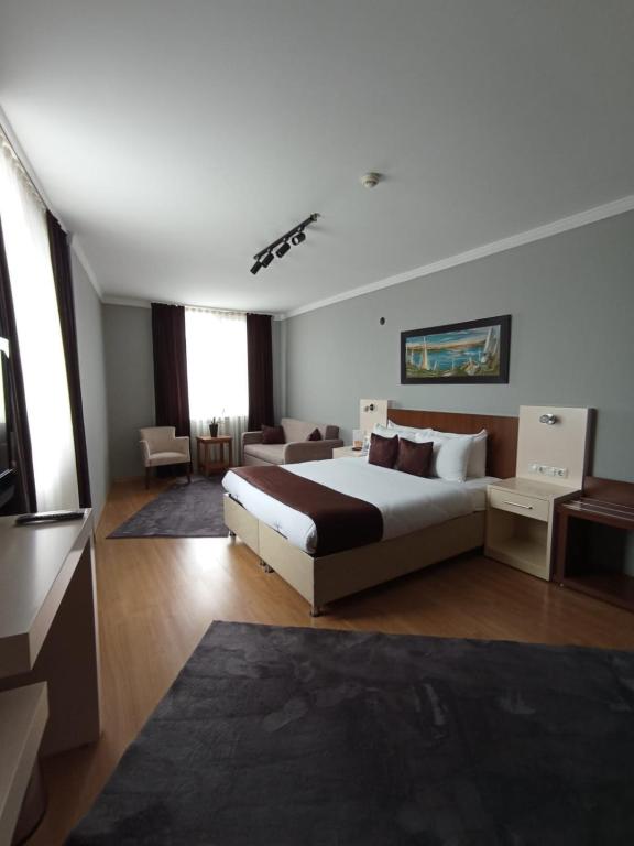Postel nebo postele na pokoji v ubytování Gosterisli Otel