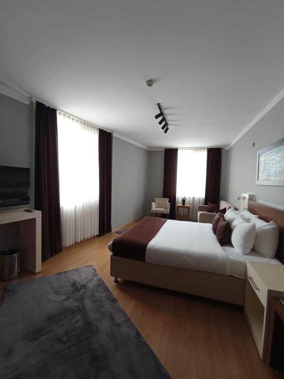 Postel nebo postele na pokoji v ubytování Gosterisli Otel