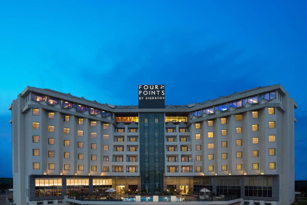 a rendering of the four seasons hotel cairo at dusk at Four Points By Sheraton Visakhapatnam in Visakhapatnam