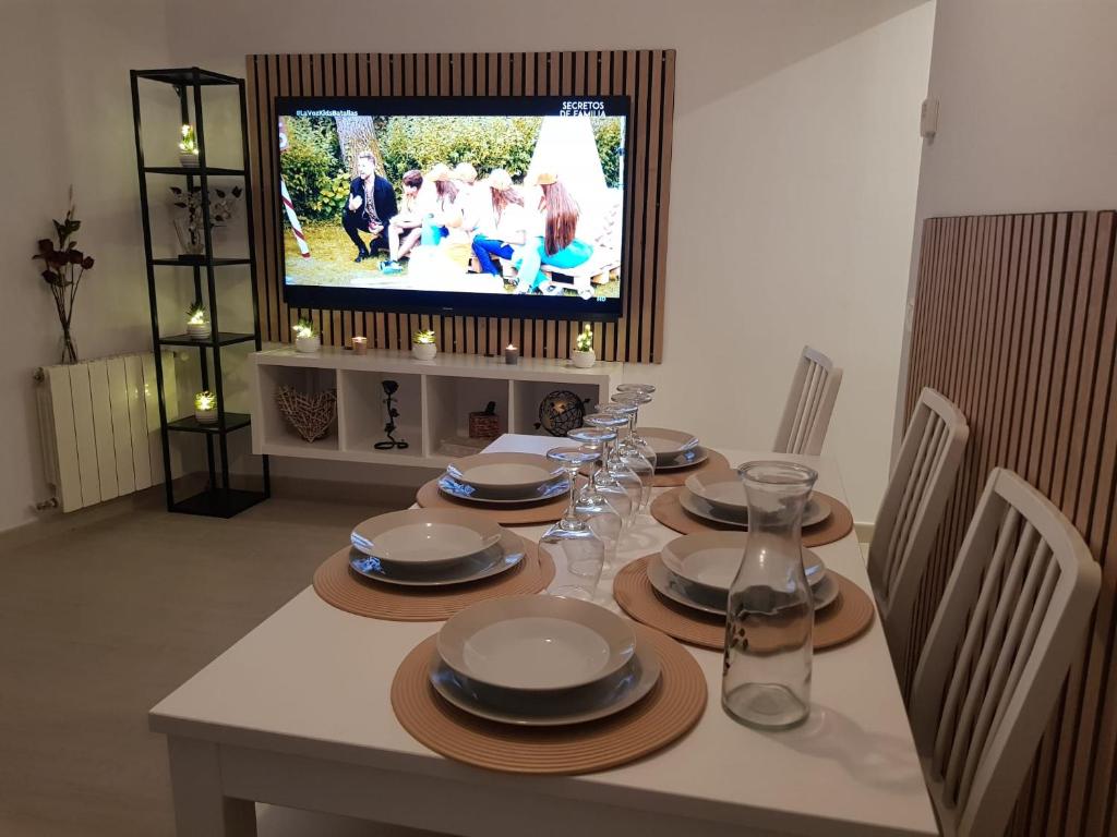 TV a/nebo společenská místnost v ubytování Apartaments L’ARC