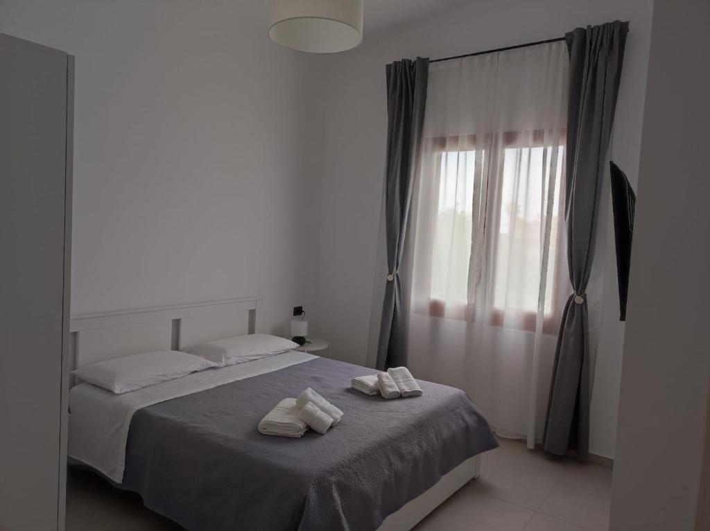 Postel nebo postele na pokoji v ubytování Villa Rita Apartament & Rooms
