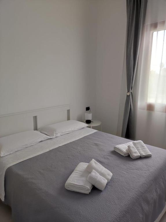 Postel nebo postele na pokoji v ubytování Villa Rita Apartament & Rooms