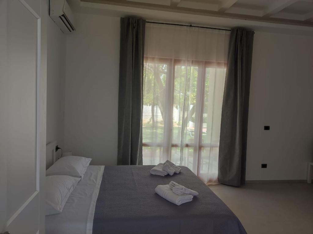 Postel nebo postele na pokoji v ubytování Villa Rita Apartament & Rooms