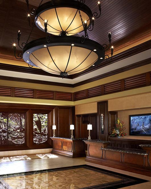 a large lobby with a chandelier in a building at Hilton Grand Waikikian in Honolulu