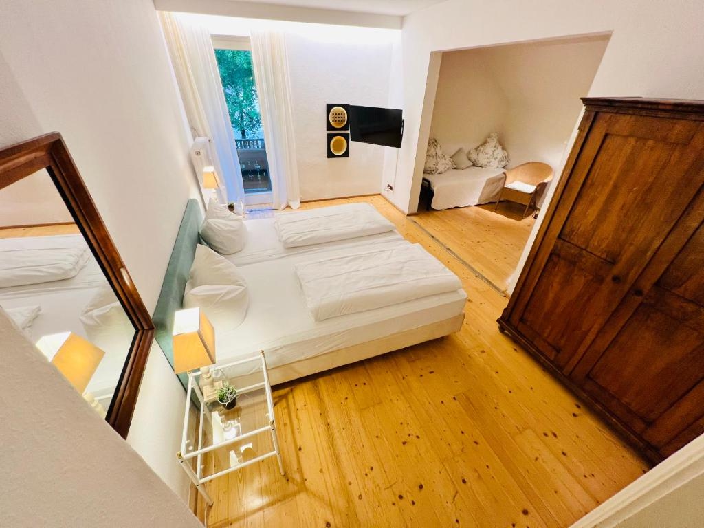 Postel nebo postele na pokoji v ubytování Hotel Kolbergarten