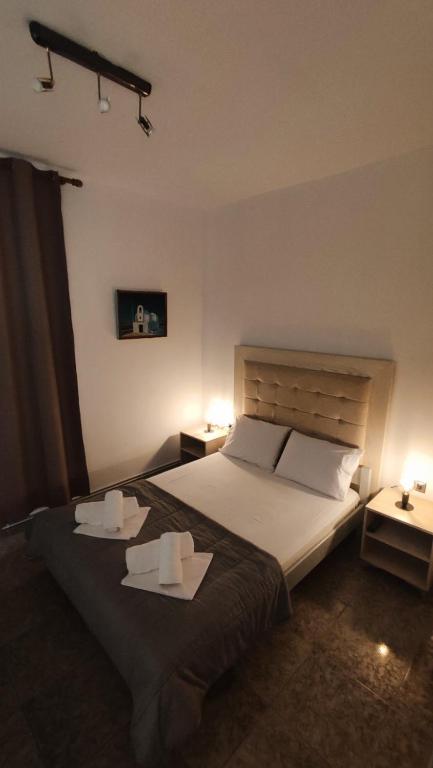 A bed or beds in a room at Alexander Apartments Nea Koutali