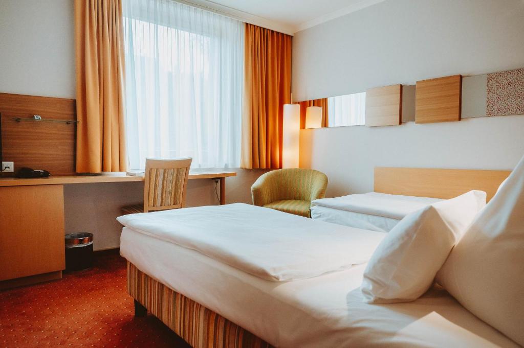 Postel nebo postele na pokoji v ubytování Hotel Brücklwirt