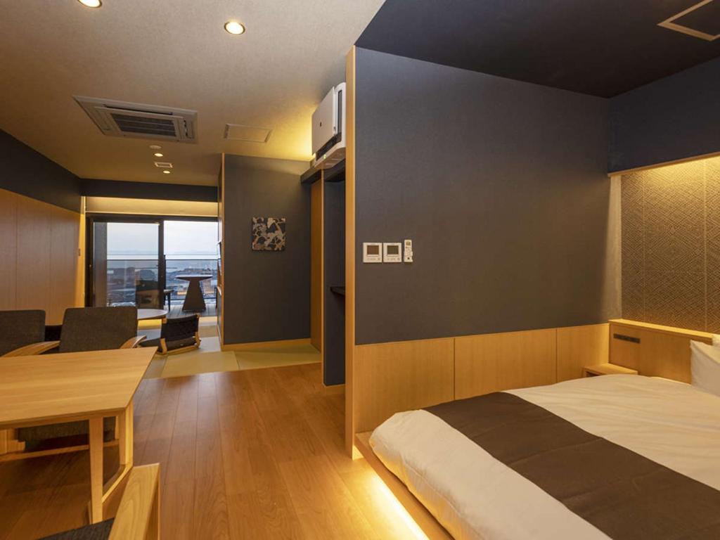 Postel nebo postele na pokoji v ubytování Yunaginoyu Hotel Hanajyukai