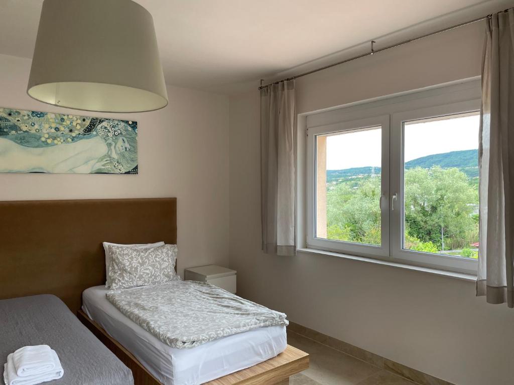 Postel nebo postele na pokoji v ubytování ANGELO