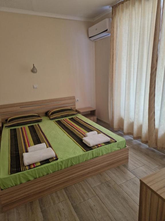 Postel nebo postele na pokoji v ubytování Dara Hotel