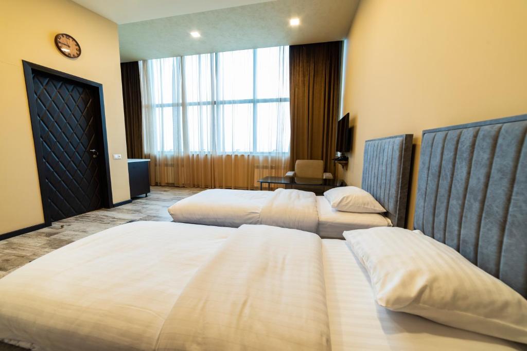 Postel nebo postele na pokoji v ubytování B H Y Guesthouse in Yerevan
